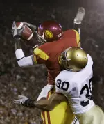 Dwayne Jarrett catches his second TD pass of the game during the first quarter. (AP Photo)
