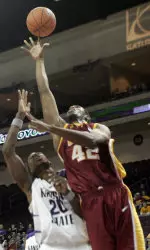 RouSean Cromwell (42) goes for a rebound against Kansas State's Cartier Martin (20) during the second half. (AP Photo/Keith Shimada)