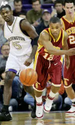 Ryan Francis and Washington forward Bobby Jones chase a loose ball during first half PAC 10 basketball play. (AP Photo/Scott Cohen)
