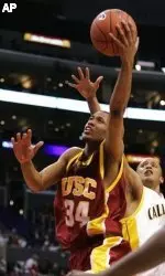Southern Cal's Gabriel Pruitt puts up a shot as California's Omar Wilkes guards during the first half. (AP Photo/Mark J. Terrill)