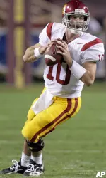 Quarterback John David Booty, who threw for 375 yards and four touchdowns, drops back to throw a pass against Arizona State in the first quarter.
