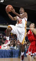 O.J. Mayo goes up for a shot as Miami's Alex Moosmann guards during the first half at the Anaheim Classic