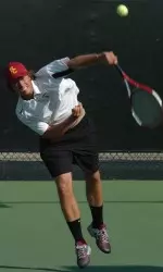 Kaes Van't Hof and Robert Farah take a shot at the top seed in Sunday's doubles championship.