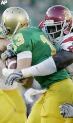 Sedrick Ellis, shown here sacking Notre Dame's Evan Sharpley, is one of the 15 seminfinalists for the 2007 Bednarik Award. (AP Photo)