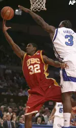 O.J. Mayo goes to the basket against Memphis' Joey Dorsey during the first half.