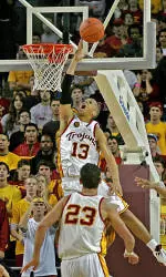 Daniel Hackett gets through the Stanford defense. (AP Photo)