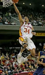 Gabe Pruitt goes to the basket for a lay-up over California's Jerome Randle. (AP Photo/Branimir Kvartuc)