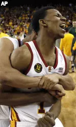 Dwight Lewis embraces teammate Nick Young (1) as they celebrate their 71-68 victory over ninth-ranked Oregon. (AP Photo/Gus Ruelas)