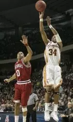 USC guard Gabe Pruitt shoots next to Arkansas guard Gary Ervin in the first half. (AP Photo)
