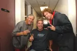 Pete Carroll and Will Ferrell meet with event namesake Mike Nyeholt following the