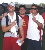 Coach Lange with hammer thrower Adam Midles and shot putter Noah Bryant.