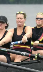Coach DeQuine rowing from the No. 4 seat with the Varsity Eight in 2002