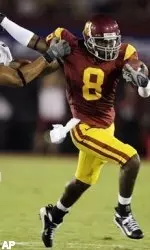 Ronald Johnson stiff-arms Idaho's Brandon Ogletree during the second quarter. (AP Photo/Kevork Djansezian)