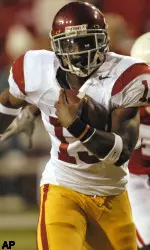 Southern California's Stafon Johnson (13), carries the ball as Nebraska's Larry Asante gives chase in the first half. (AP Photo/Dave Weaver)