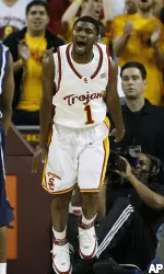 Angelo Johnson celebrates after making a basket against Arizona. (AP Photo/Gus Ruelas)