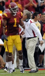 Wide receiver Patrick Turner (1) is congratulated by head coach Pete Carroll after scoring a touchdown during the first half against Washington. (AP Photo/Mark J. Terrill)