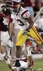 Stafon Johnson runs over a Stanford player in the fourth quarter.