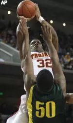 O.J. Mayo takes a jumper over Oregon's Joevan Catron. (AP Photo/Jeff Lewis)
