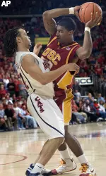 O.J. Mayo tries to fend off Arizona's Daniel Dillon. (AP Photo/Wily Low)