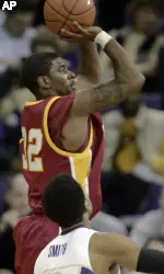 O.J. Mayo fires a jump shot over Washington's Joel Smith in the Trojans' 73-59 win. (AP Photo/Joe Nicholson)
