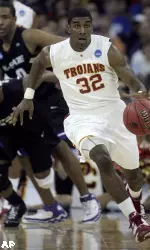 O.J. Mayo leads a fast break against Kansas State. (AP Photo/Dave Weaver)