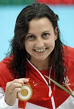 Rebecca Soni shows off her gold medal after winning the 200-meter breaststroke at the 2008 Beijing Olympics.