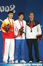 Larsen Jensen (far right) on the medal stand after winning bronze in the 400m free.