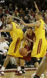 Daniel Hackett pressures Stanford guard Mitch Johnson. (AP Photo/Francis Specker)