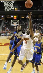 Marcus Johnson puts up a shot as Coppin State's Sam Coleman and Vince Goldsberry defend.