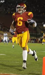 Malcolm Smith, left, scores a touchdown after intercepting a pass.