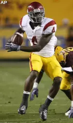 Joe McKnight eludes the Arizona State defense.