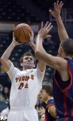 Southern California guard Mike Gerrity (44) puts up a shot over Saint Mary's center Omar Samhan in the second half of an NCAA college basketball game Wednesday Dec. 23, 2009, at the Diamond Head Classic in Honolulu. Southern California defeated Saint Mary's 60-49.  (AP Photo/Eugene Tanner)