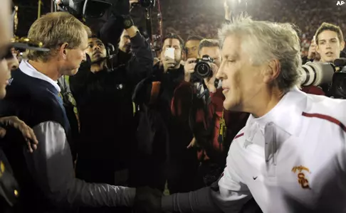 University of Southern California head coach Pete Carroll, right, shakes hands with UCLA head coach Rick Neuheisel following their NCAA college football game, Saturday, Nov. 28, 2009, in Los Angeles. USC won 28-7.