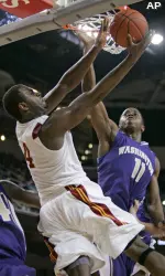 Southern California's Leonard Washington, left, attempts to score against Washington's Matthew Bryan-Amaning during the first half. (AP Photo/Jason Redmond)