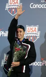 Rebecca Soni smashed the American record in the 100m breast on Thursday at the 2009 U.S. World Championship Trials.