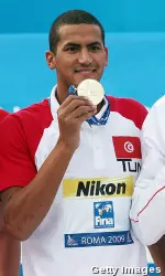 Ous Mellouli showing off his gold in the 1500m freestyle at the 2009 FINA World Championships.
