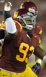 Everson Griffen celebrates a sack against Washington State quarterback Marshall Lobbestael during the first half.
