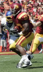 Matt Barkley (7) hands off to running back Stafon Johnson (13) who runs it in for a touchdown during the first quarter of an NCAA college football game against San Jose State