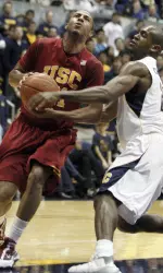 California's Patrick Christopher attempts to steal the ball from Dwight Lewis during the first half.