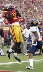 David Ausberry hauls in a touchdown pass under pressure from California cornerback Marc Anthony during the first half.