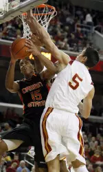 Oregon State guard Jared Cunningham (1) takes aim as Mike Gerrity (44) gets his hand up to block a shot in the first half
