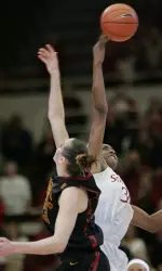 Nnemkadi Ogwumike (30) reaches above Southern California center Kari LaPlante (13) during the opening tip-off.
