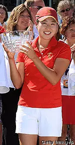 Jennifer Song holding the trophy she received for finishing as the low amateur at the 2010 Kraft Nabisco Championship.