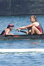 USC's Dionne Lucidine peaks at the UCLA boat during Troy's first varsity eight win over the Bruins.