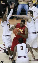 Southern California's forward Alex Stepheson holds on to the ball around a slew of Arizona State defenders.