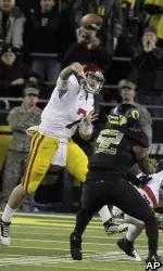 Matt Barkley throws on the run.