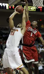 USC's Aaron Fuller (21) raises up for a shot against UNLV's Quintrell Thomas in the first half. (AP Photo/Julie Jacobson)