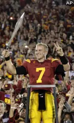 Southern California quarterback Matt Barkley celebrates USC's 50-0 win.