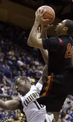 Southern California's Jio Fontan, right, shoots over California's Markhuri Sanders-Frison.