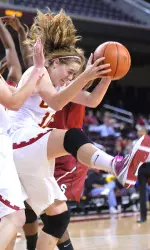Southern California's Cassie Harberts, right, grabs a rebound in front of teammate Kari LaPlante, left, during the first half.